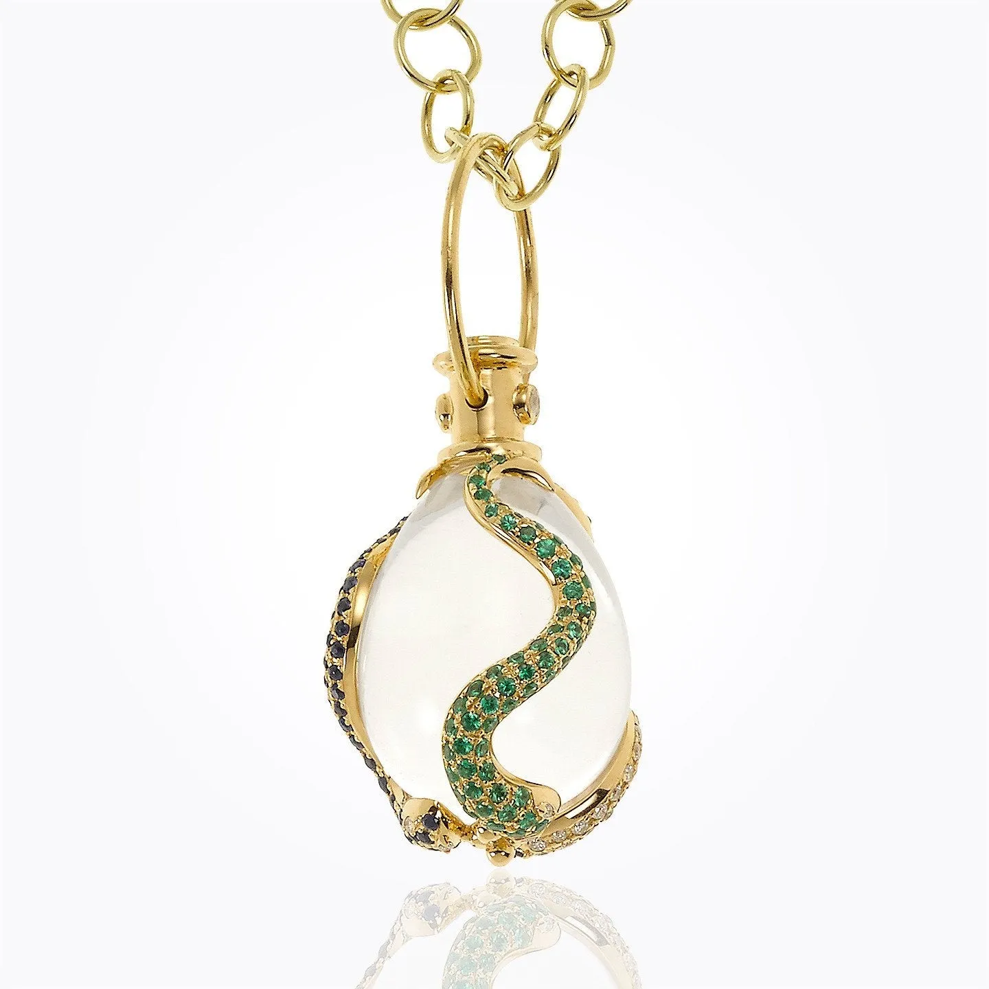 18K Serpent Amulet with oval rock crystal, blue sapphire , tsavorite, and diamond pavé