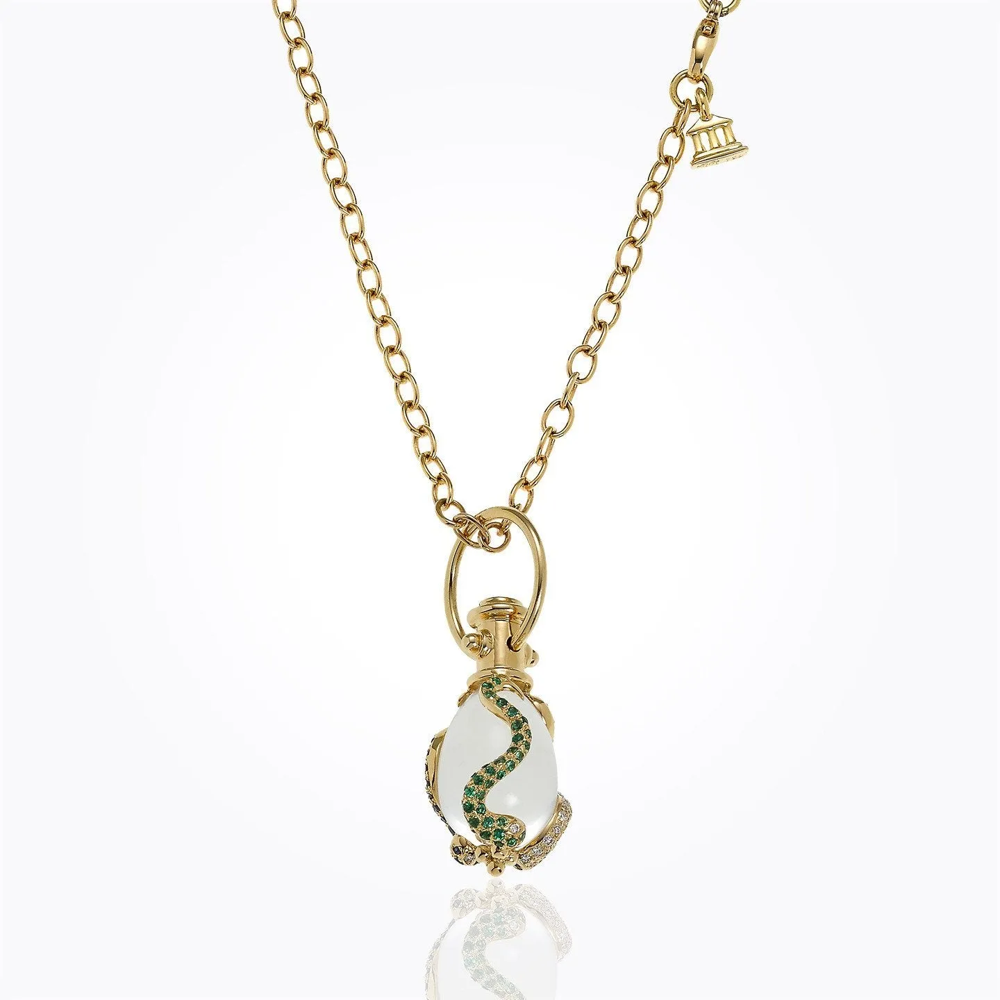 18K Serpent Amulet with oval rock crystal, blue sapphire , tsavorite, and diamond pavé