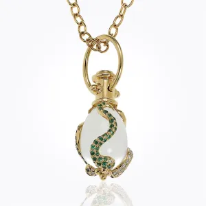 18K Serpent Amulet with oval rock crystal, blue sapphire , tsavorite, and diamond pavé