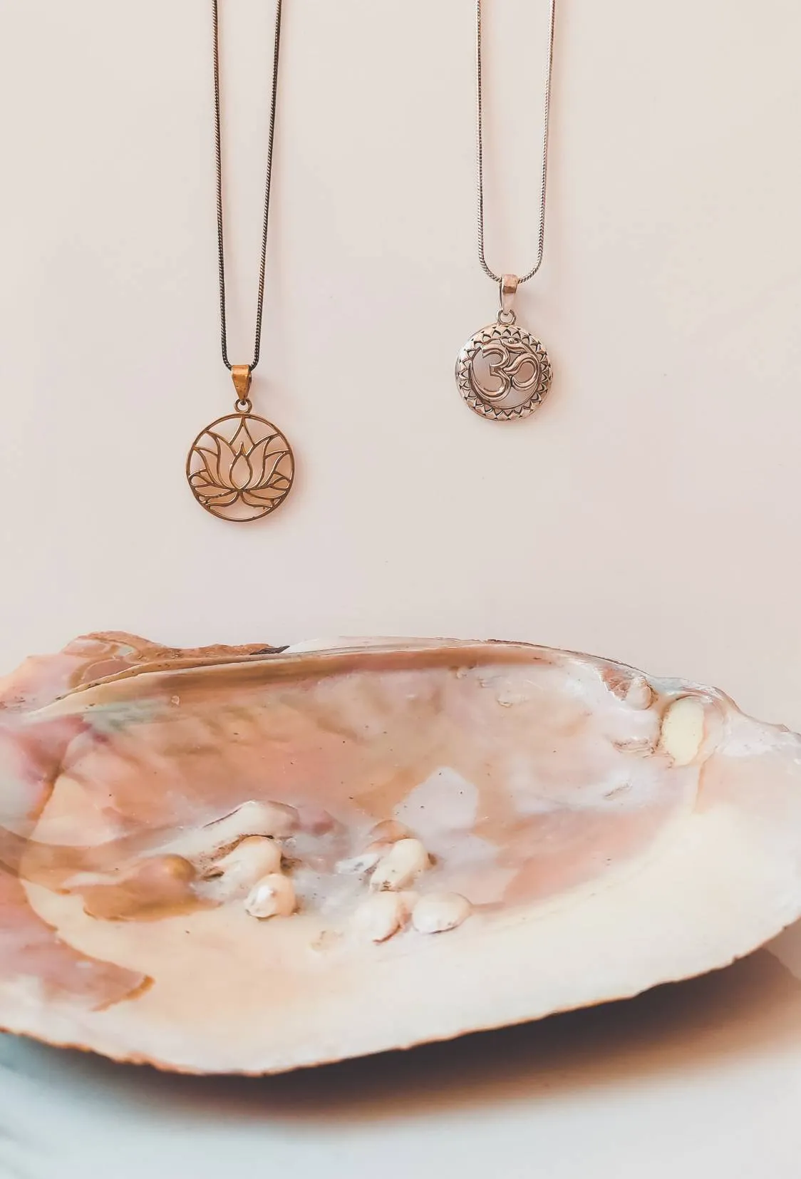 Gold Lotus Flower and Silver Om Necklaces