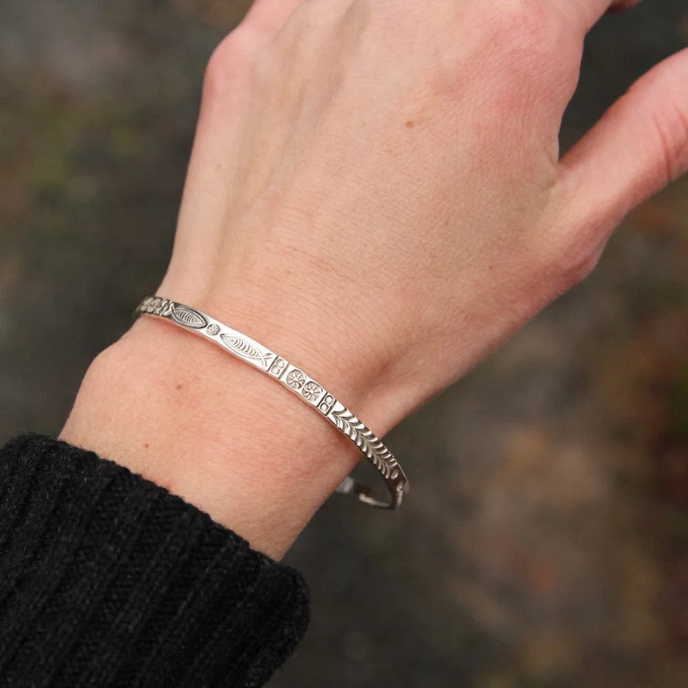 Stamped Fish and Fern Bangle