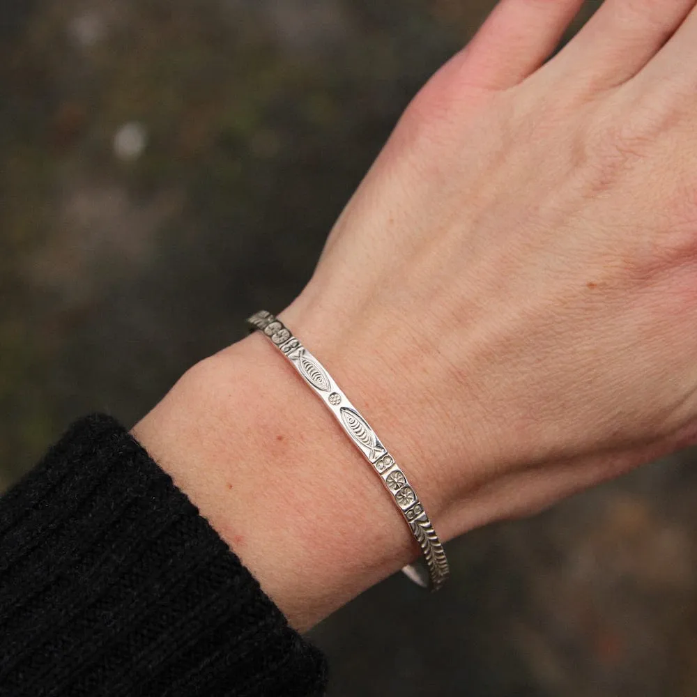 Stamped Fish and Fern Bangle